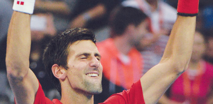Novak Djokovic celebrates his victory over Rafael Nadal after their China Open final in Beijing on Sunday. (AFP)