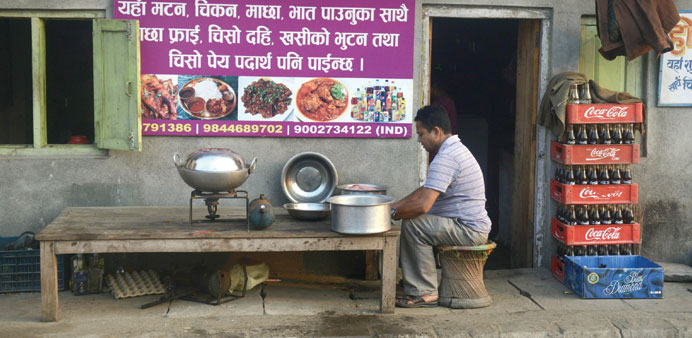 A Nepalese man prepares food on a kerosene stove amid shortage of gas cylinders in Kakarbhitta on the Nepal-India border.