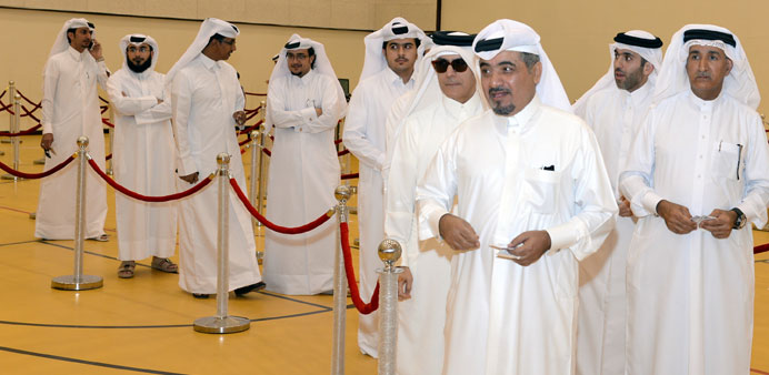 Qataris queuing up to vote in the CMC elections yesterday.