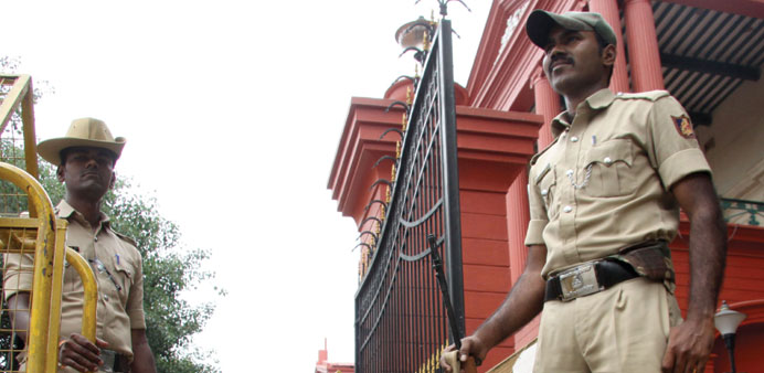 A policeman stands outside the Karnataka High Court as authorities stepped up security ahead of the verdict in Jayalalithaau2019s case, in Bengaluru yeste