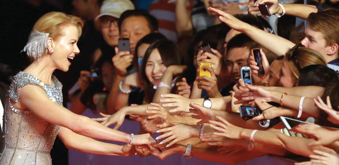 Australian actress Nicole Kidman interacts with fans at the Shanghai International Film Festival opening ceremony in Shanghai.