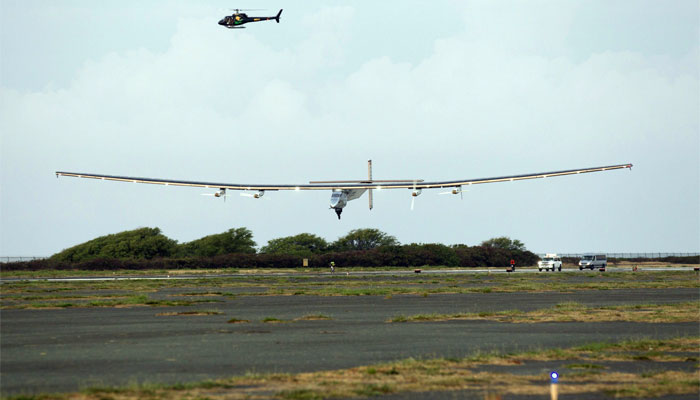 The Solar Impulse 2, a solar powered airplane, piloted by Andre Borschberg, lands at  Kalaeloa Airport, Hawaii.