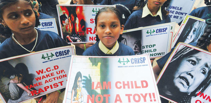 Children from NGO u2018Child Rights Initiative for Shared Parentingu2019 hold placards during a silent protest in Bangalore against sexual harassment of child