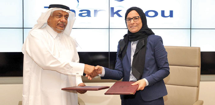 Prof Sheikha Abdulla al-Misnad and Abdullah Salem al-Sulaiteen shaking hands after signing the MoU.
