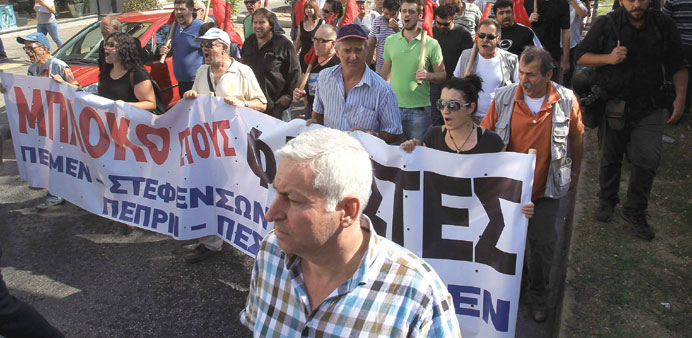 Demonstrators take part in a protest march against fascism in Athens yesterday.