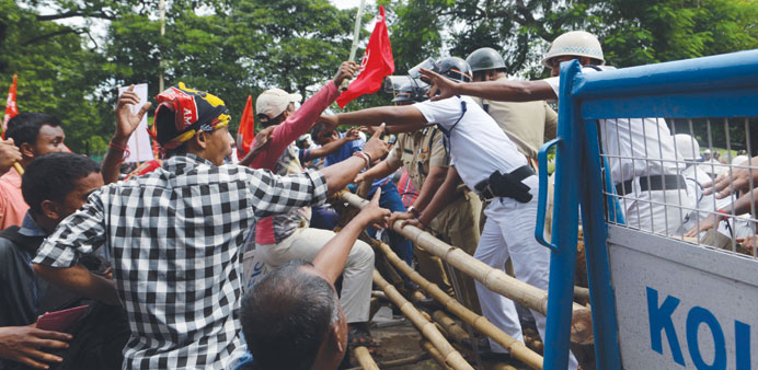 Police and farmers clash after rally called by the opposition Left Front turned violent in Kolkata yesterday.