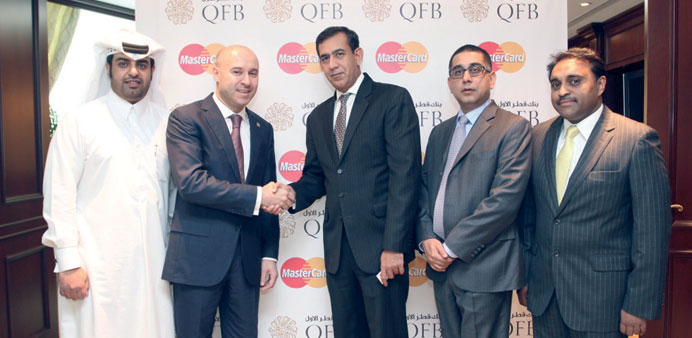 Officials at the launch of the  first Shariah-compliant metal World Elite MasterCard Charge Card in Qatar and the Mena region.