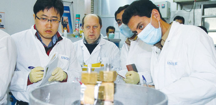 An IAEA team checks the enrichment process at the Natanz facility yesterday.