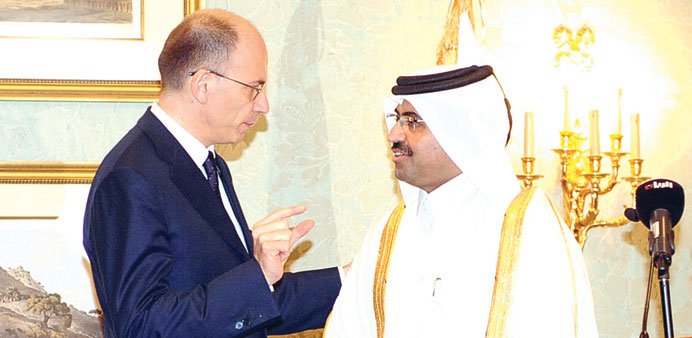 Italian Prime Minister Enrico Letta and HE the Minister of Energy and Industry Dr Mohamed bin Saleh al-Sada  in conversation just before they jointly 