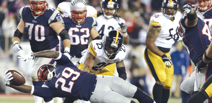 New England Patriots running back LeGarrette Blount scores a touchdown against the Pittsburgh Steelers in the second half at Gillette Stadium. The Pat