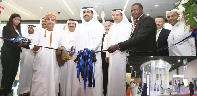    HE al-Sada inaugurating the 8th edition of the Doha International Oil and Gas Exhibition yesterday. Right: The QP stand at the DIOGE. QP is the hos