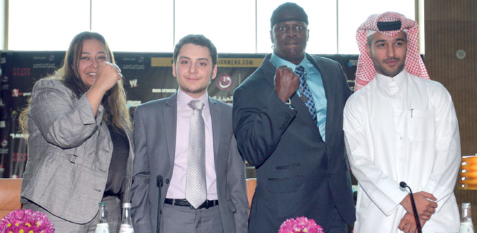 R-Truth, Hamad al-Khaja and others pose for a picture after the press briefing yesterday.