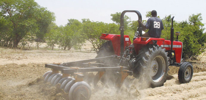 A farmer plows the field in Saulawa village, on the outskirts of Nigeriau2019s north-central state of Kaduna.