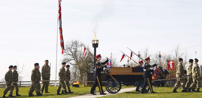 Cadets wheel Richard IIIu2019s coffin off the battlefield at Bosworth, near Leicester, central England, yesterday.