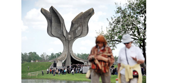 People attend a ceremony in Jasenovac for the thousands of victims who died at the Jasenovac camp.