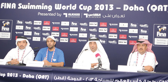 President of the Qatar Swimming Association Khaleel al-Jabir (second right) addressing a press conference on the eve of the FINA Swimming World Cup in