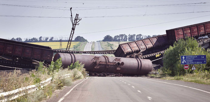 A picture made available yesterday shows a blown-up railway bridge blocking the road between Charkov and Donetsk.