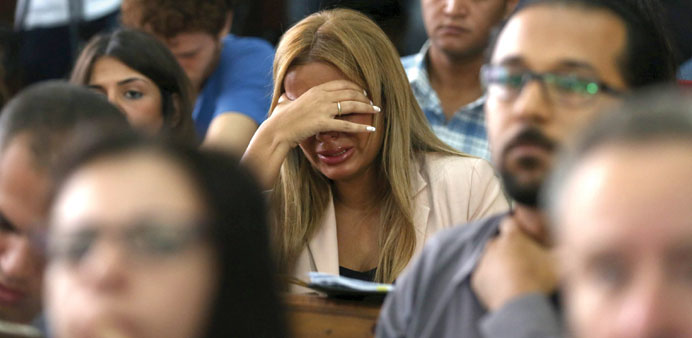 Marwa Omara, wife of Al Jazeera journalist Mohamed Fahmy, reacts after hearing the verdict at a court in Cairo yesterday. 