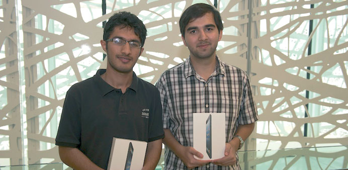 Students Ahwaz Akhtar (left) and Syed Owais Ali posing with their prizes for their joint submission on academic integrity.