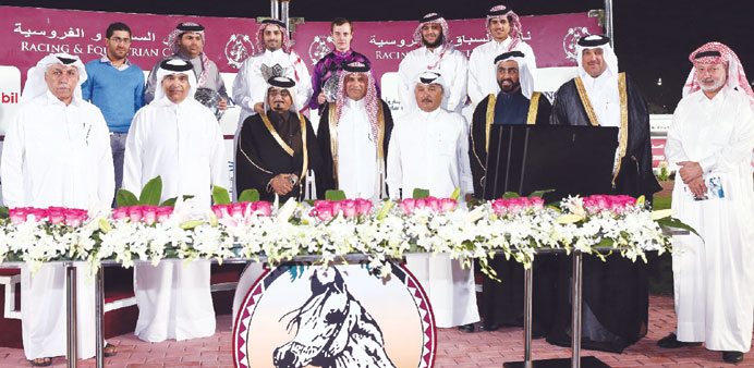 Under secretary in the Ministry of Justice Mr Sultan bin Abdullah al-Suwaidi (third from left) and QREC chairman Sheikh Mohammed bin Faleh al-Thani (t
