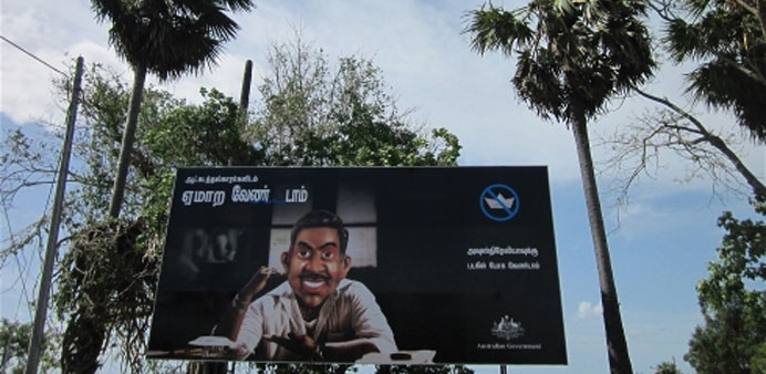 u201cDonu2019t be led by illegal boat operatorsu201d warns a government billboard in Sri Lankau2019s eastern Batticaloa district.