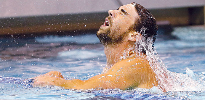 Michael Phelps wins the menu2019s 100m butterfly final during day one of the Arena Grand Prix at Mecklenburg County Aquatic Center on Friday in Charlotte,