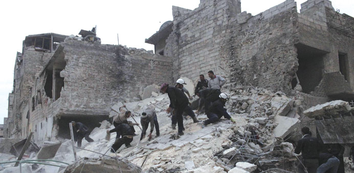People search for casualties under rubble at a site hit by what activists said was shelling by government forces in Aleppou2019s Al Jazmati district yeste