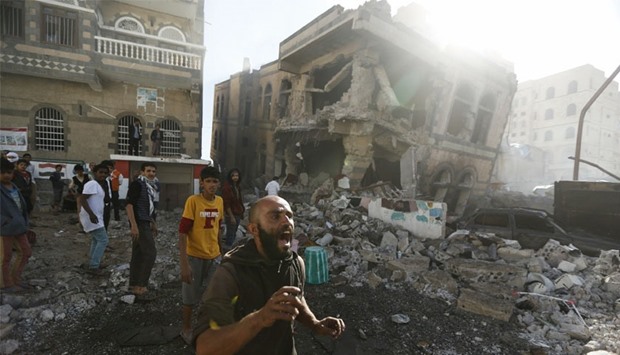 A man reacts at the site of a Saudi-led air strike in Yemen's capital Sanaa. Reuters