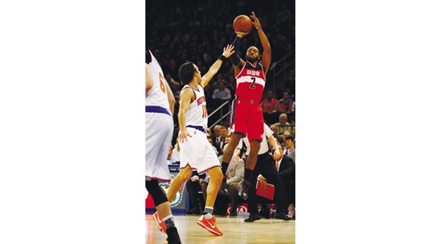 John Wall of the Washington Wizards shoots against Sasha Vujacic 18 of the New York Knicks during their NBA game at Madison Square Garden on on Tuesday.