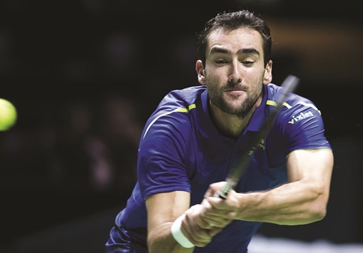Croatiau2019s Marin Cilic returns the ball to Luxembourgu2019s Gilles Muller during their second round match of the ABN AMRO World Tennis Tournament in Rotterdam. (AFP)