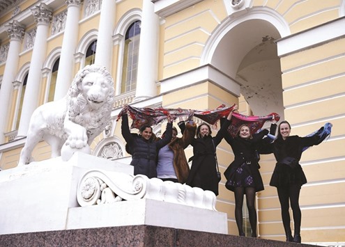 Left to right: Sania Mirza of India, Iva Majoli of Croatia, Maria Goloviznina and Polina Rodionova of Russia and Martina Hingis of Switzerland pose for pictures on the steps of the Russian Museum in St. Petersburg as part of activities during the St. Petersburg Ladies Trophy 2016 Tennis tournament. (AFP)