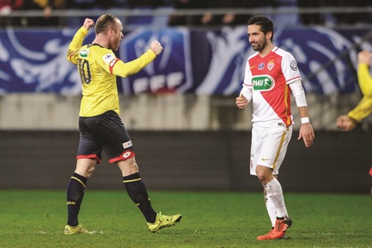 Sochaux midfielder Florian Martin (L) celebrates as Monaco midfielder Joao Moutinho looks on at the end of the French Cup match at the Auguste Bonal Stadium in Montbeliard.