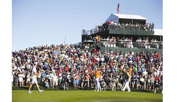Rickie Fowler lines up a putt on the second playoff hole during the final round of the Waste Management Phoenix Open at TPC Scottsdale in Scottsdale, Arizona. (Getty Images/AFP)