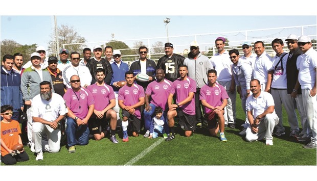 HE Dr Mohamed bin Saleh al-Sada and Abdulrahman Ali al-Abdulla join players and attendees in celebrating National Sport Day.