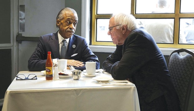 Bernie Sanders meets Al Sharpton at Sylviau2019s restaurant in the Harlem section of New York yesterday.