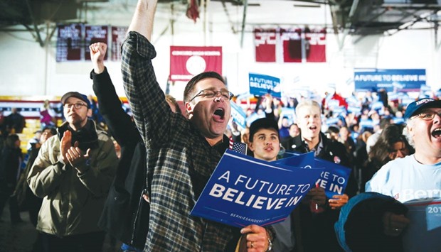 Supporters react to television predictions of Sanders winning the Democratic New Hampshire primary at the candidateu2019s New Hampshire Primary Night watch party in Concord, New Hampshire.