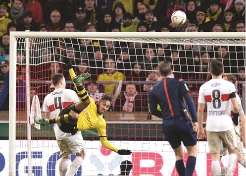 Dortmundu2019s Pierre-Emerick Aubameyang (2ndL)  in action during the German Cup quarter-final against Stuttgart.