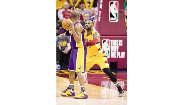 LeBron James of the Cleveland Cavaliers guards Kobe Bryant of the Los Angeles Lakers during the second half of their game at Quicken Loans Arena in Cleveland on Wednesday.