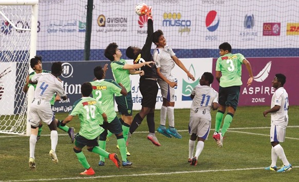 Action from the match between Aspire Football Dreams and Al Ahli yesterday.
