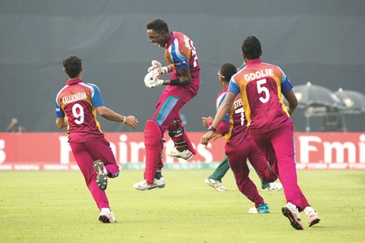 West Indies players celebrate after winning the ICC U19 World Cup semi-final against Bangladesh in Mirpur yesterday. (ICC)