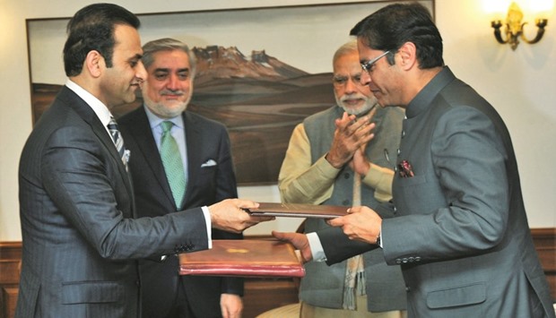 Modi and Abdullah Abdullah witness the exchange of agreement for visa-free travel for diplomatic passport holders of India and Afghanistan, in New Delhi yesterday.