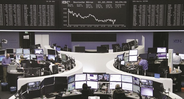 Traders work at their desks at the Frankfurt Stock Exchange. The DAX 30 lost 0.41% yesterday.