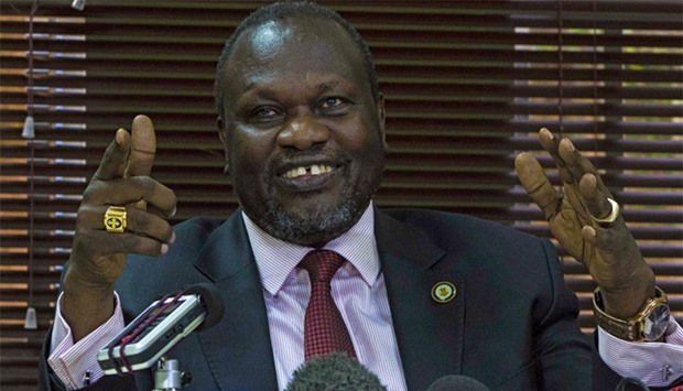 South Sudan's rebel leader Riek Machar gesturing as he holds a press conference in Kampala on January 26, 2016