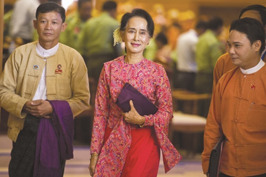 Myanmaru2019s National League for Democracy (NLD) chairperson Aung San Suu Kyi leaves after the new lower house parliamentary session in Naypyidaw yesterday.