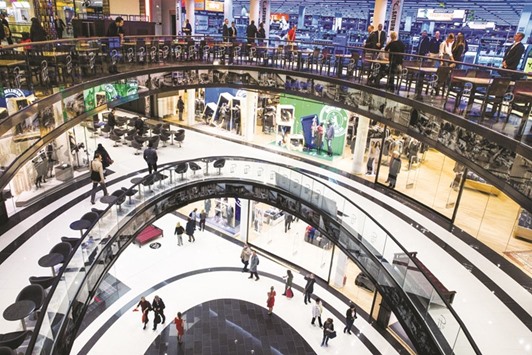 People walk through the Mall of Berlin shopping centre in Berlin. German gross domestic product (GDP) growth, at 0.3%, offset weaker performances from southern eurozone countries by virtue of its sheer size.