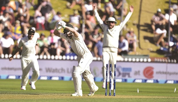 Adam Voges (C) of Australia is bowled but it was called a no ball during the first Test against New Zealand in Wellington yesterday. (AFP)