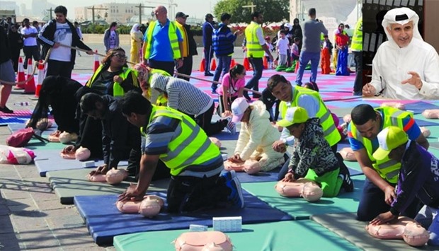 Volunteers of the u201cCPR Saves Livesu201d programme teach children and adults how to perform CPR. Inset, Dr Khalid Abdulnoor Saifeldeen. PICTURE: Shemeer Rasheed.