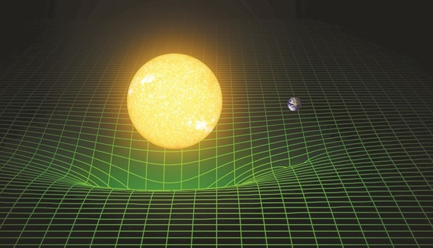 A computer simulation shows how our sun and Earth warp space and time, or spacetime, represented here with a green grid in this image released in Washington on Thursday. Scientists have for the first time detected gravitational waves, ripples in space and time hypothesised by Albert Einstein a century ago, in a landmark discovery that opens a new window for studying the cosmos.