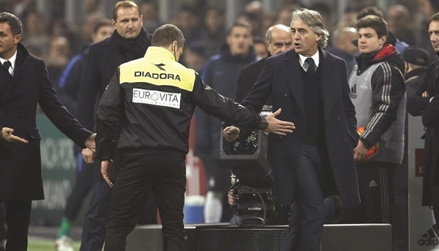 Inter Milanu2019s coach Roberto Mancini (centre) reacts after his expulsion during the match against AC Milan. (Reuters)