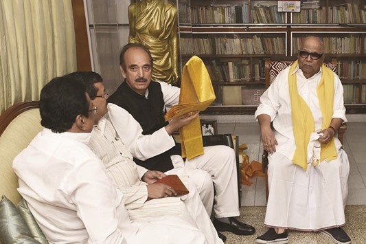 Congress leader Ghulam Nabi Azad speaks to DMK leaders as party chief M Karunanidhi looks on in Chennai yesterday.